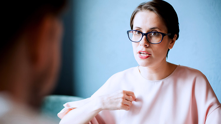 Woman having serious discussion with man