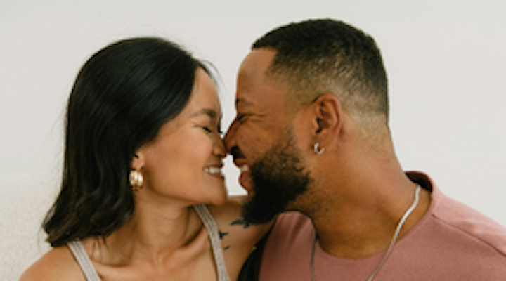 An engaged woman and man touch noses in an embrace. In the event of divorce, marital property is divided based on South Carolina laws or the predetermined agreement that’s written into SC prenuptial agreements. 