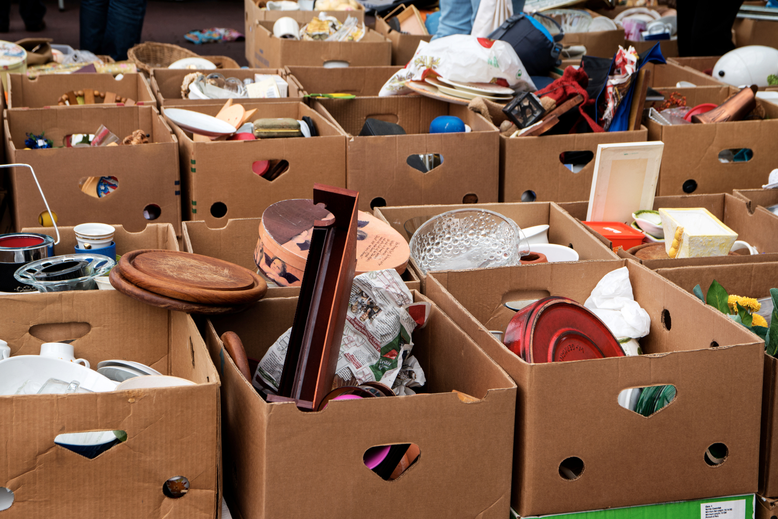 Boxes are packed for an estate sale. While you can hold a DIY estate sale, such an event requires meticulous planning so you can get maximum returns.