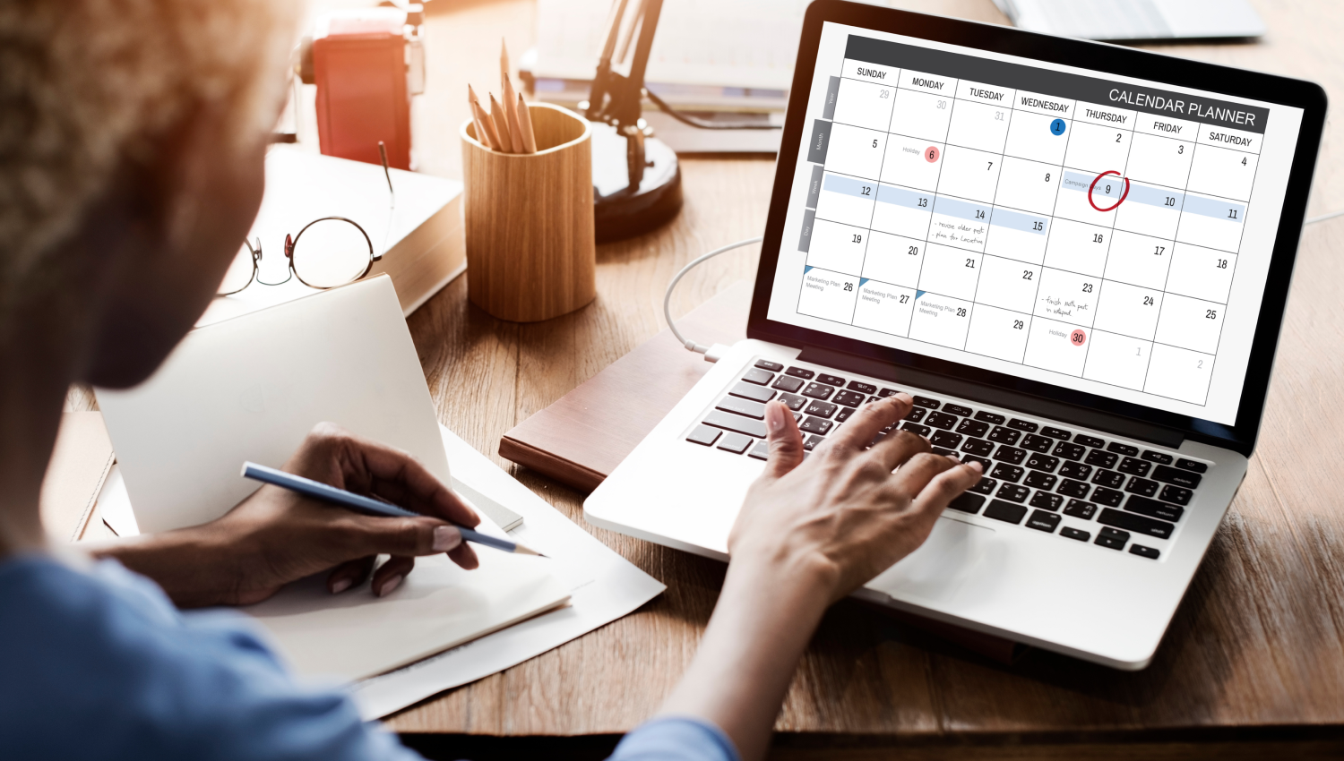 woman sitting at her desk using LegalZoom Total Compliance 