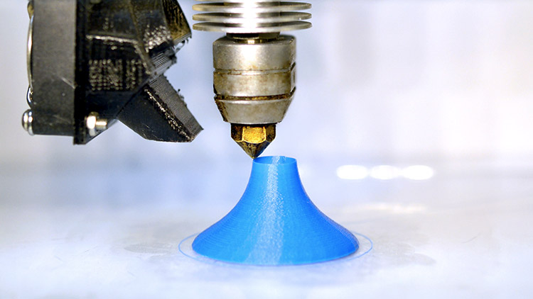 3D printer making blue object