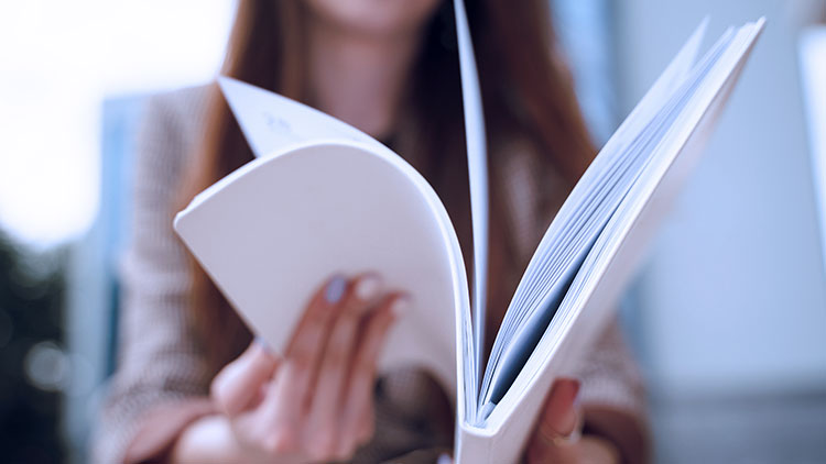 Woman flipping through documents