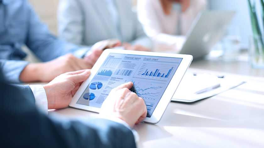 business-meeting-looking0at-charts-graphs