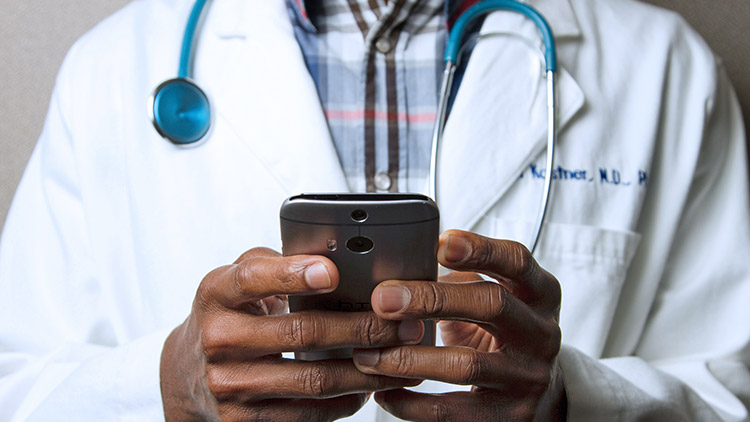 Doctor holding mobile phone