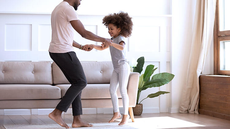 father_dancing_barefoot_with_daughter