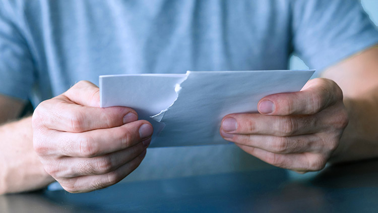 Man opening letter