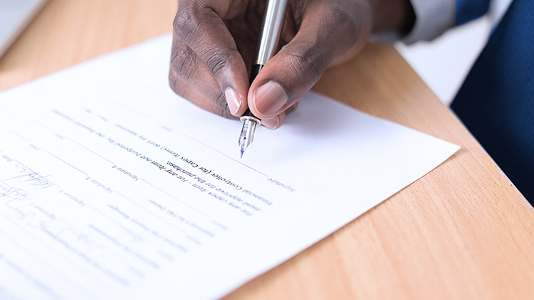 Man signing official document