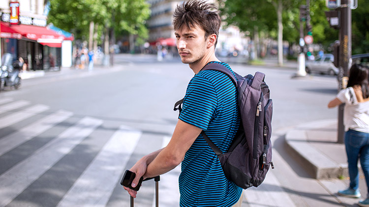 Man standing by crosswalk