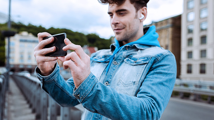 Man taking photo on mobile phone