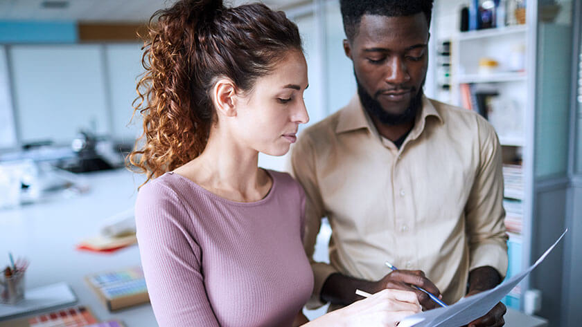 woman-man-looking-at-paperwork