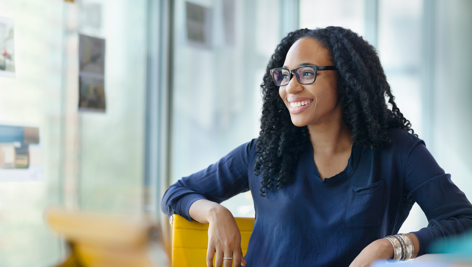 Inspired entrepreneur sitting in a bright office