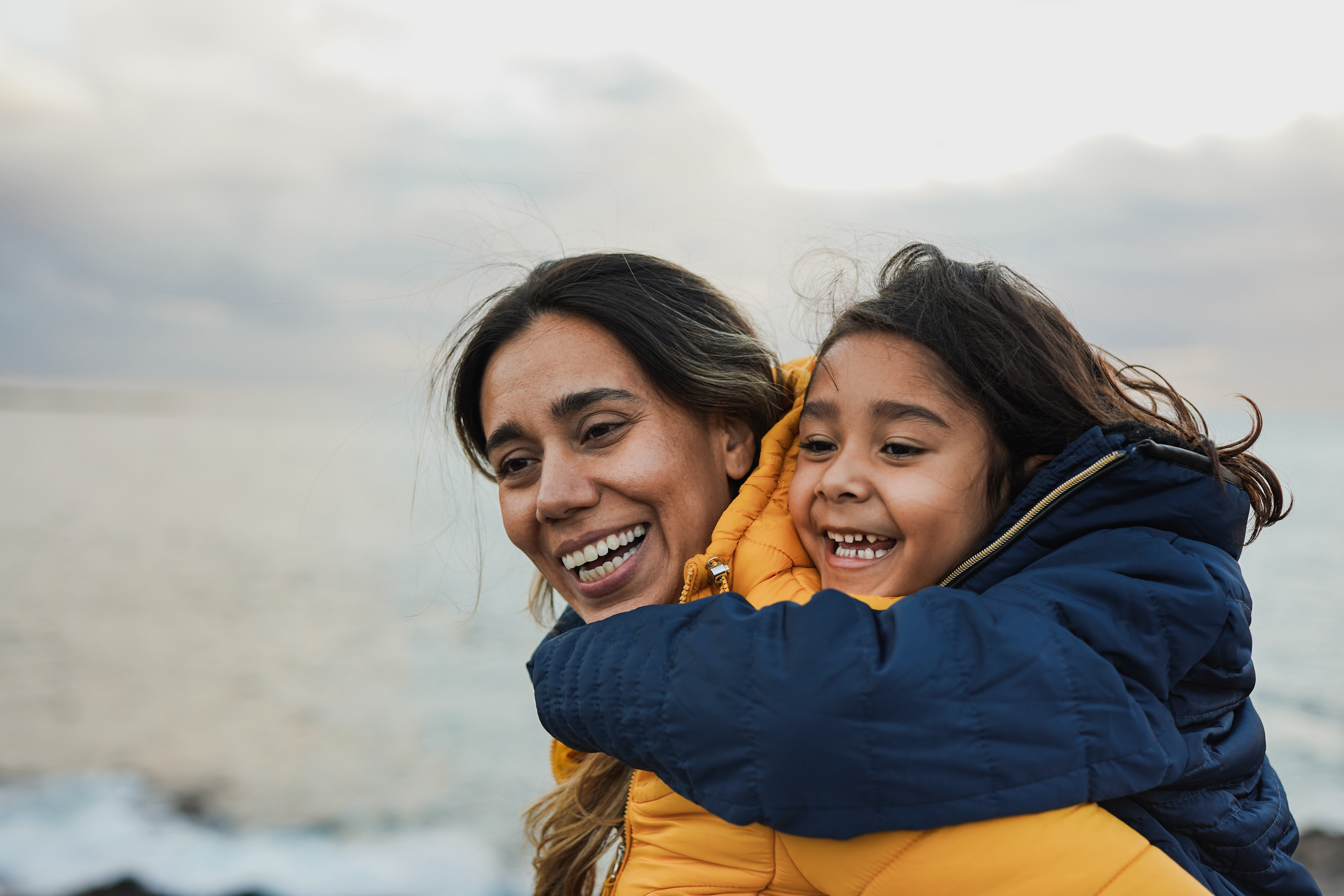 A woman carries her young daughter piggyback style. An estate plan estate plan plays a pivotal role in ensuring your assets end up in the right hands
