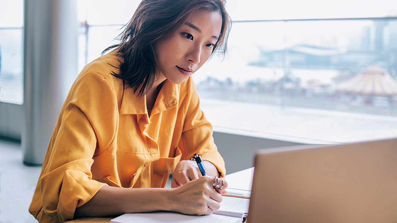 A woman works on a DIY living trust in front of an open laptop computer. While establishing a DIY living trust possible, an attorney’s guidance can ensure the trust documents its proper setup, and mitigate potential legal complications.