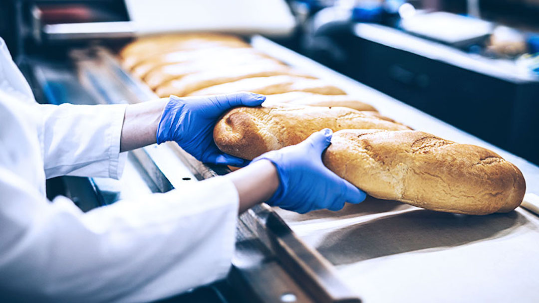 After receiving an online order, a baker takes loaves of bread out of the oven. Creating an online presence for your Florida dba can yield several benefits, including enhanced brand identity, customer trust, and connection with the target audience.
