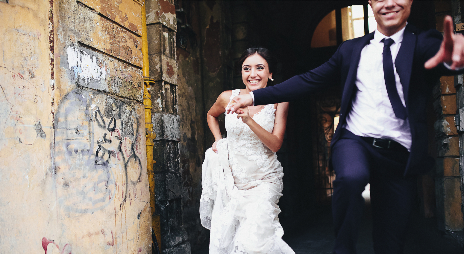 A woman and a man dressed in wedding attire hold hands. When you get married, there are a range of issues to consider to put you on the right foot.