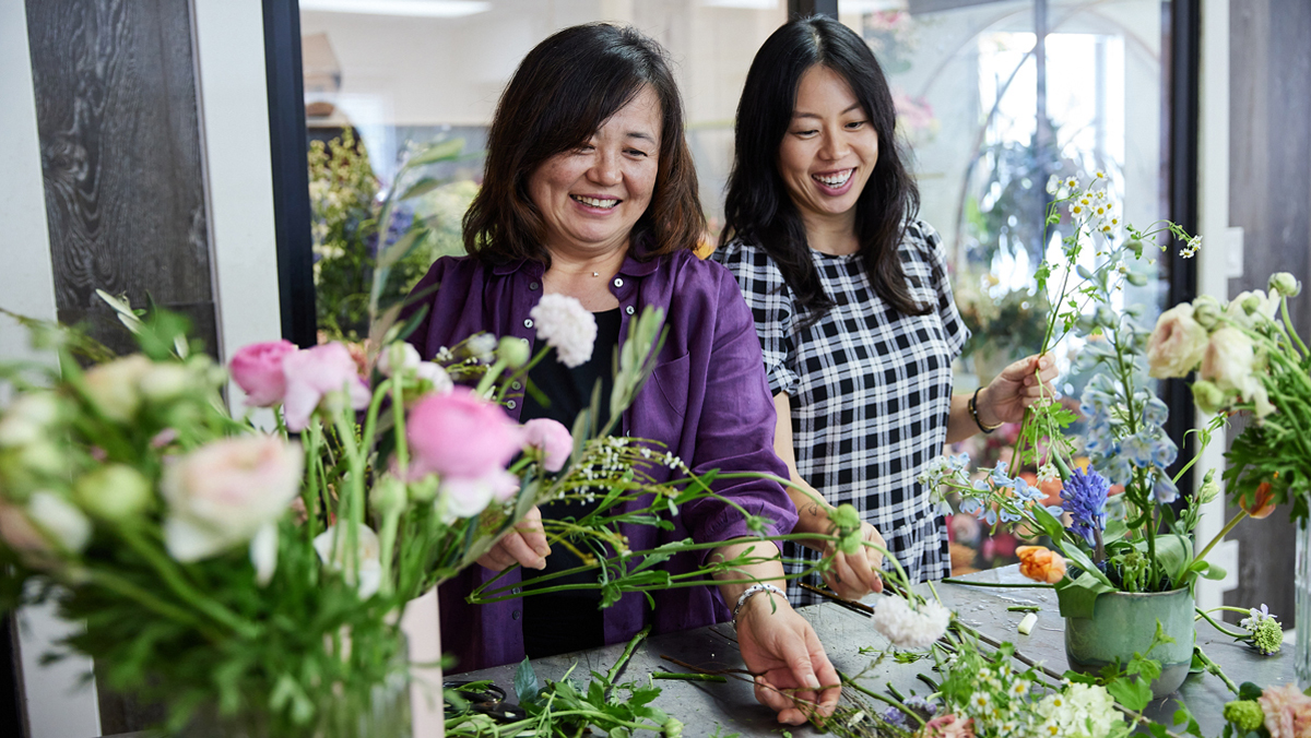 Two women from the same family work at a floral shop. Payroll taxes and tax witholding apply even when employing  a family member.