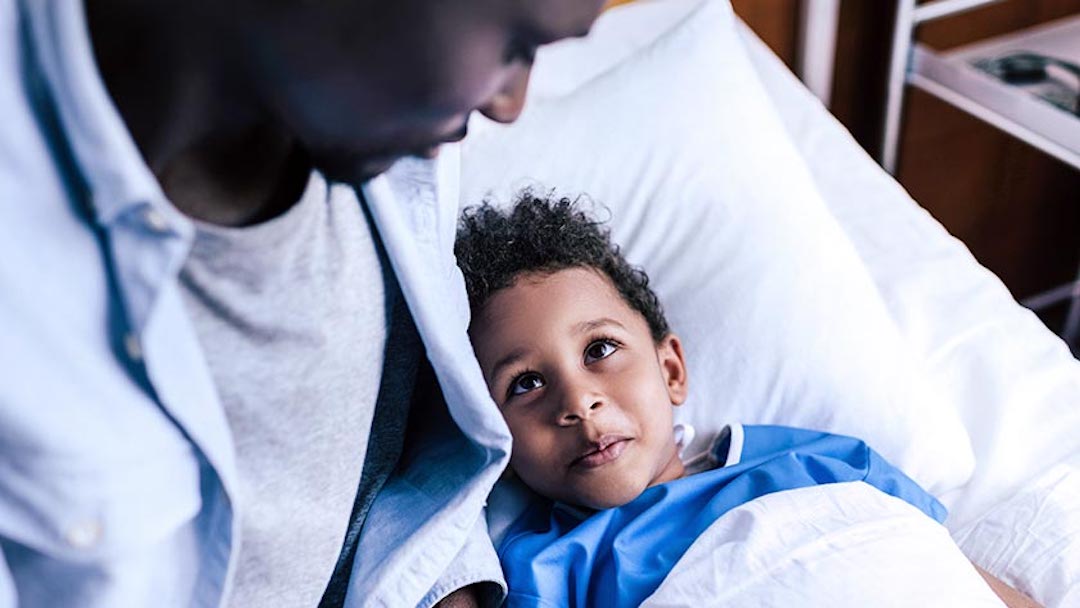 A man tucks in his son at bedtime. Creating a last will and testament in Texas is crucial in ensuring your estate is distributed according to your wishes upon death. 