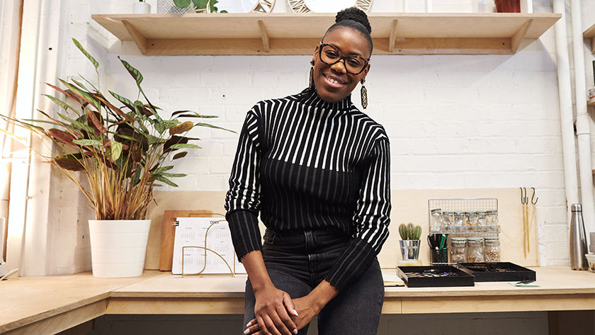 black woman standing in front of office 