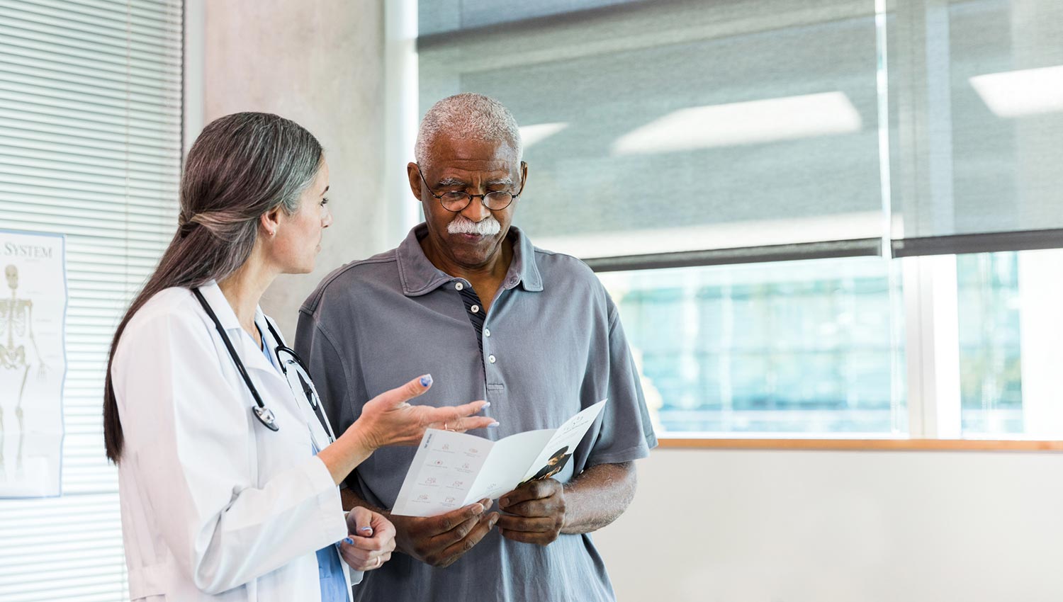 A doctor and a patient discuss a living will vs. an advance directive for medical planning.