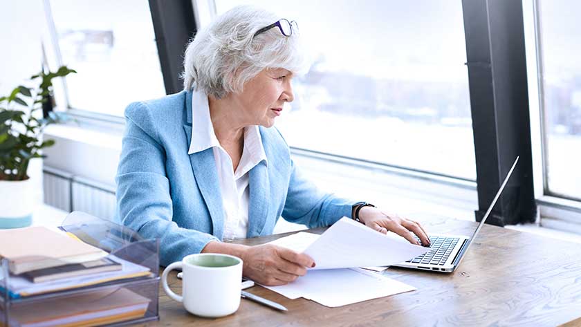 senior-businesswoman-on-laptop