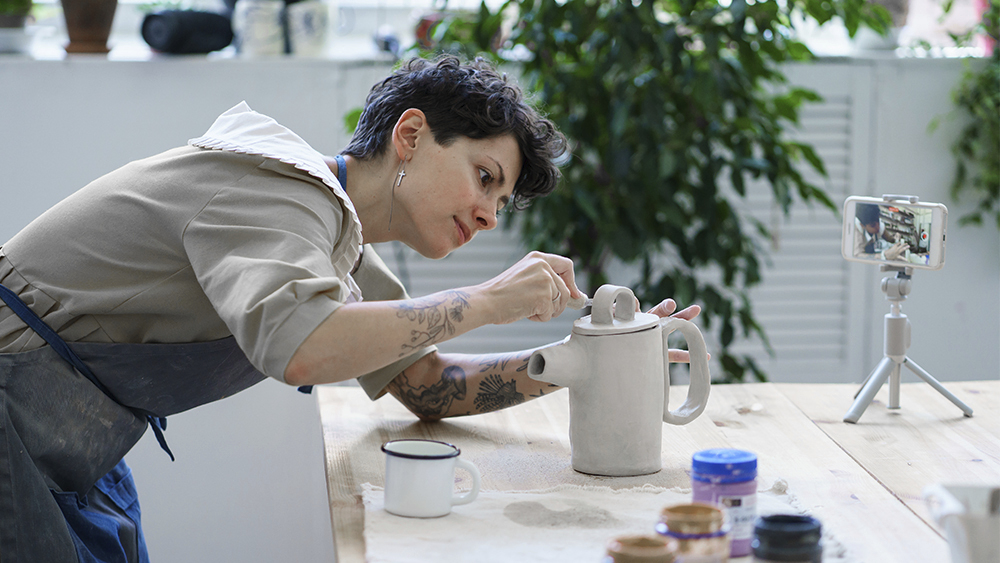 woman making pottery video
