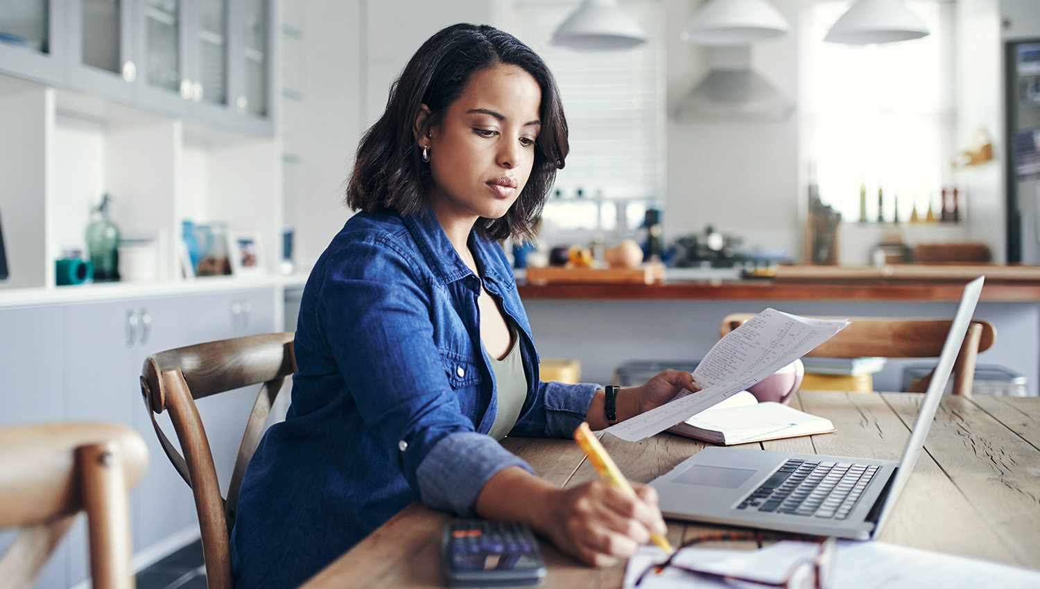 A woman works on her LLC operating agreement from home