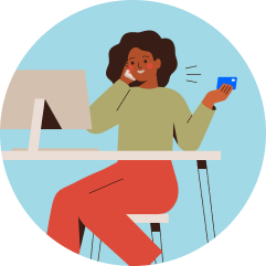 Illustration of a woman with dark hair wearing a green shirt and red pants sitting in front of the computer smiling and talking on the phone holding the Employer ID Number for her new LLC.