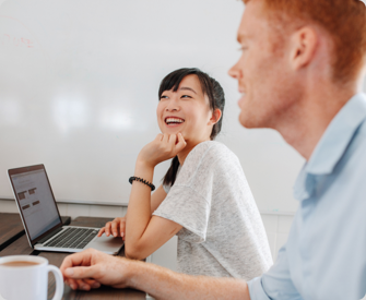 Small business owners laugh while discussing the newly required Beneficial Ownership Information Report.