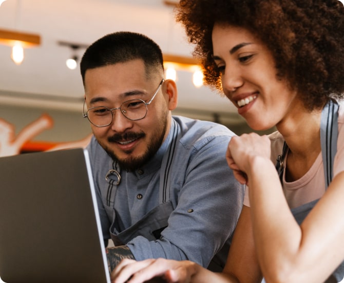 Man and woman setting up virtual mail with LegalZoom on laptop