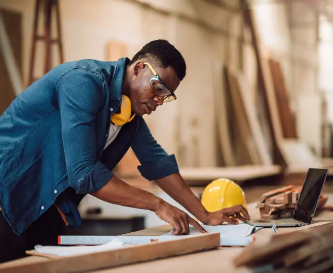 Black man working on a construction project after setting up virtual mail with LegalZoom